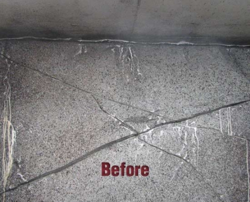 A concrete wall with multiple visible cracks running across its surface, indicating the need for repair. The word "Before" is centered in red text, highlighting the wall's condition before polyurethane grout injection is applied.