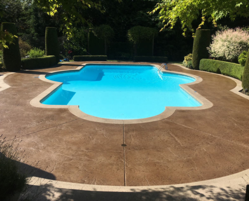 brown stamped concrete pool deck after sealing