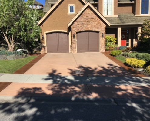 concrete driveway two car garage before staining