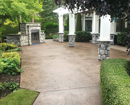 stamped concrete patio stone fireplace pergola