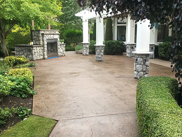 stamped concrete patio stone fireplace pergola