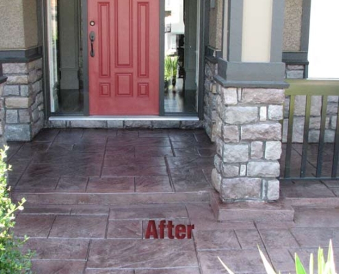 stamped concrete porch red door after sealing