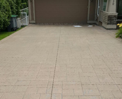 stamped tan concrete driveway before sealing