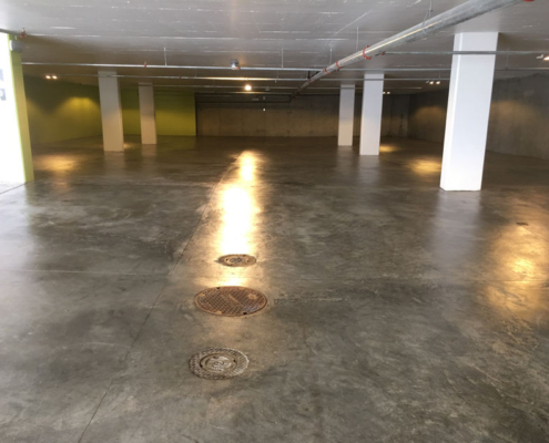 IMG_0598 underground parkade concrete floor utility covers