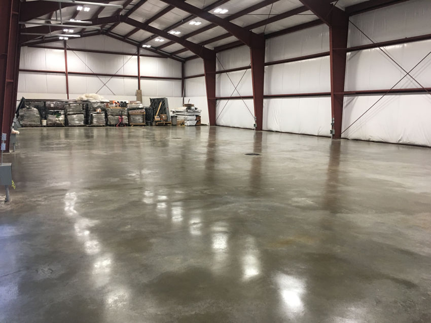 warehouse polished concrete floor red steel beams