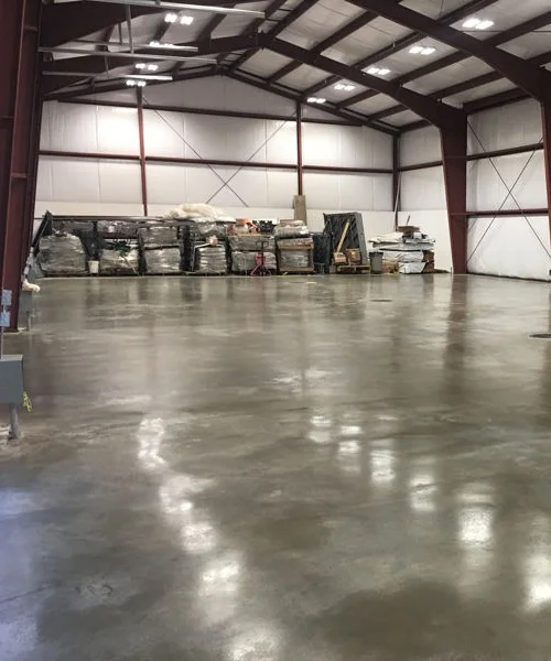 warehouse polished concrete floor red steel beams